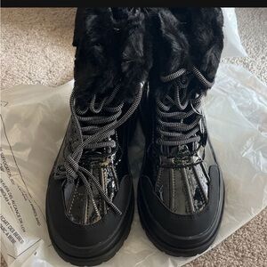 Black weather boots from torrid brand new. Never used